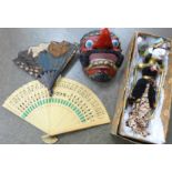 A Wayang Golek puppet doll, boxed and a Wayang Topeng comic mask plus two fans