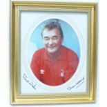 A framed photograph of Brian Clough, signed in the mount