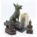 A single Art Deco dog garniture, a bronze diety and a stylised lion