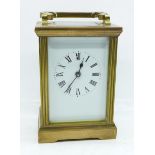 A brass and four glass sided carriage clock and key, 11.5cm