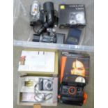 A Poplaroid 600 Extreme instant camera, boxed, a Canon Power Shot A710 IS digital camera, Nikon