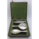A small travel silver brush set, cased