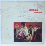 An autographed LP album cover of Duran Duran's first LP, 1981
