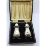 A cased silver salt and pepper pot, Adie Bros., 61g (40)
