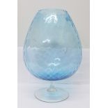 A large blue brandy glass vase