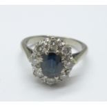 An 18ct white gold, diamond and sapphire cluster ring, 5.9g, O
