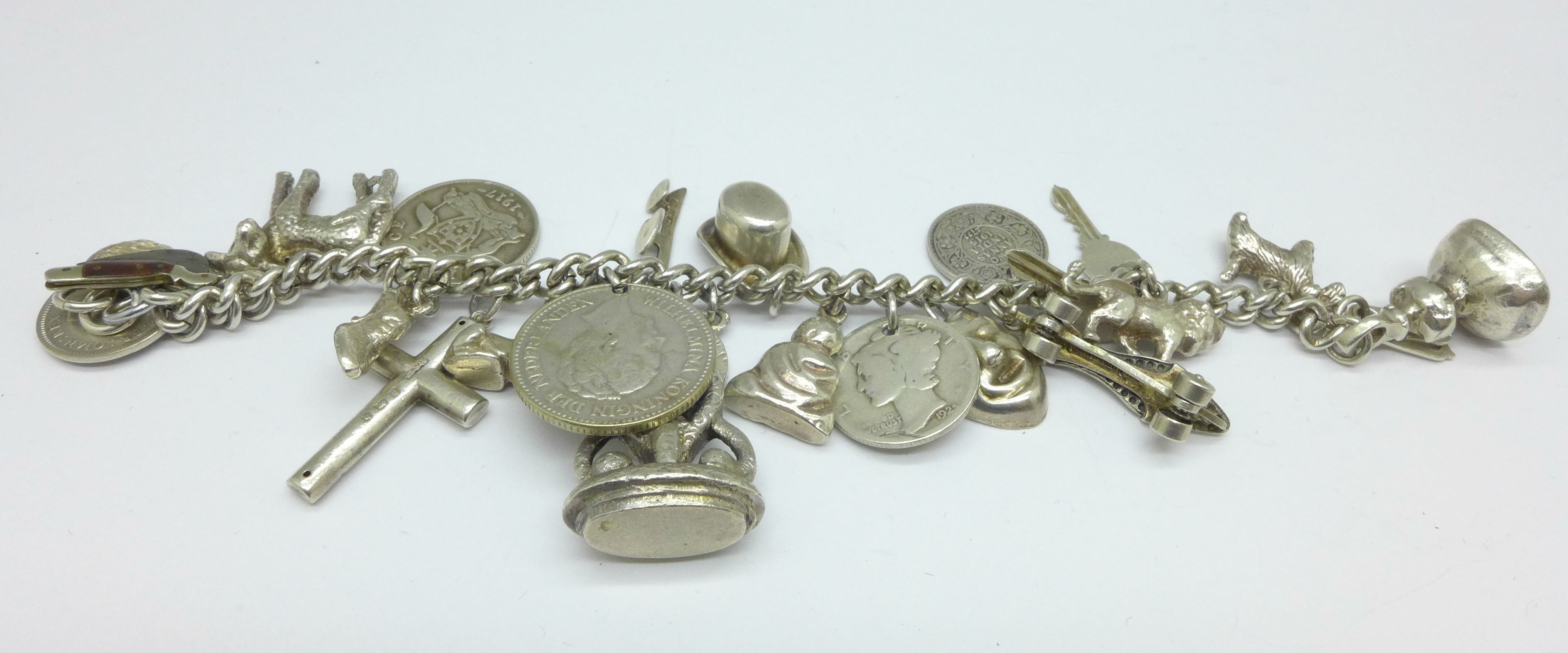 A white metal charm bracelet, 82g