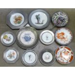 A collection of pewter framed plates and bowls