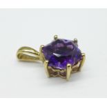 A 9ct gold and purple stone pendant, 2g