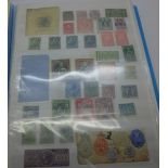 Stamps; Worldwide Revenue stamps and documents in album