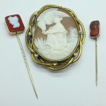 A cameo brooch and two cameo pins