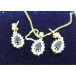 A 9ct gold, sapphire and diamond pendant with matching earrings, 3.8g