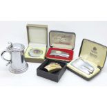 A Dunhill table lighter in tankard form and a round Prince lighter displaying a fishing fly, plus