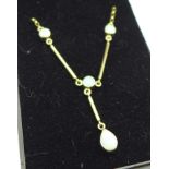 A 9ct gold and opal necklace, 3.9g