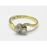 An 18ct gold, two stone diamond ring, 2.5g, M
