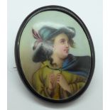 A jet mounted hand decorated portrait brooch