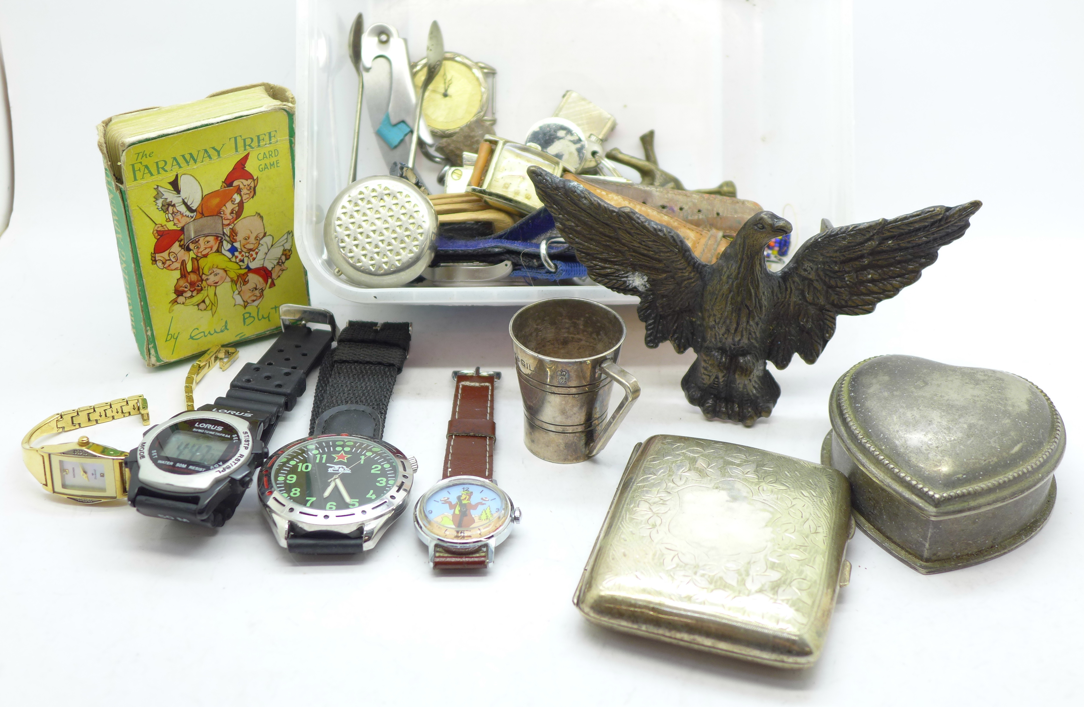 A cigarette box, watches, a brass eagle belt buckle, etc.