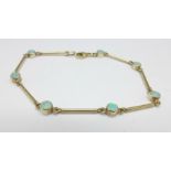 A 9ct gold and opal bracelet, 4g