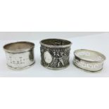 A silver cherub napkin ring and two other silver napkin rings, 57g