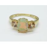 A 9ct gold ring set with synthetic opal and two other stones, 1.9g, O