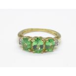 A 9ct gold, diamond and green stone ring, 2g, J