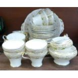 An Aynsley tea set, B4664, eleven setting, lacking one cup, with cream, sugar and sandwich plate