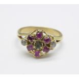 A yellow metal, ruby, emerald and white stone cluster ring, tests as 9ct gold, 2.2g, H