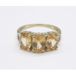A 9ct gold, diamond and stone set ring, 2.6g, L