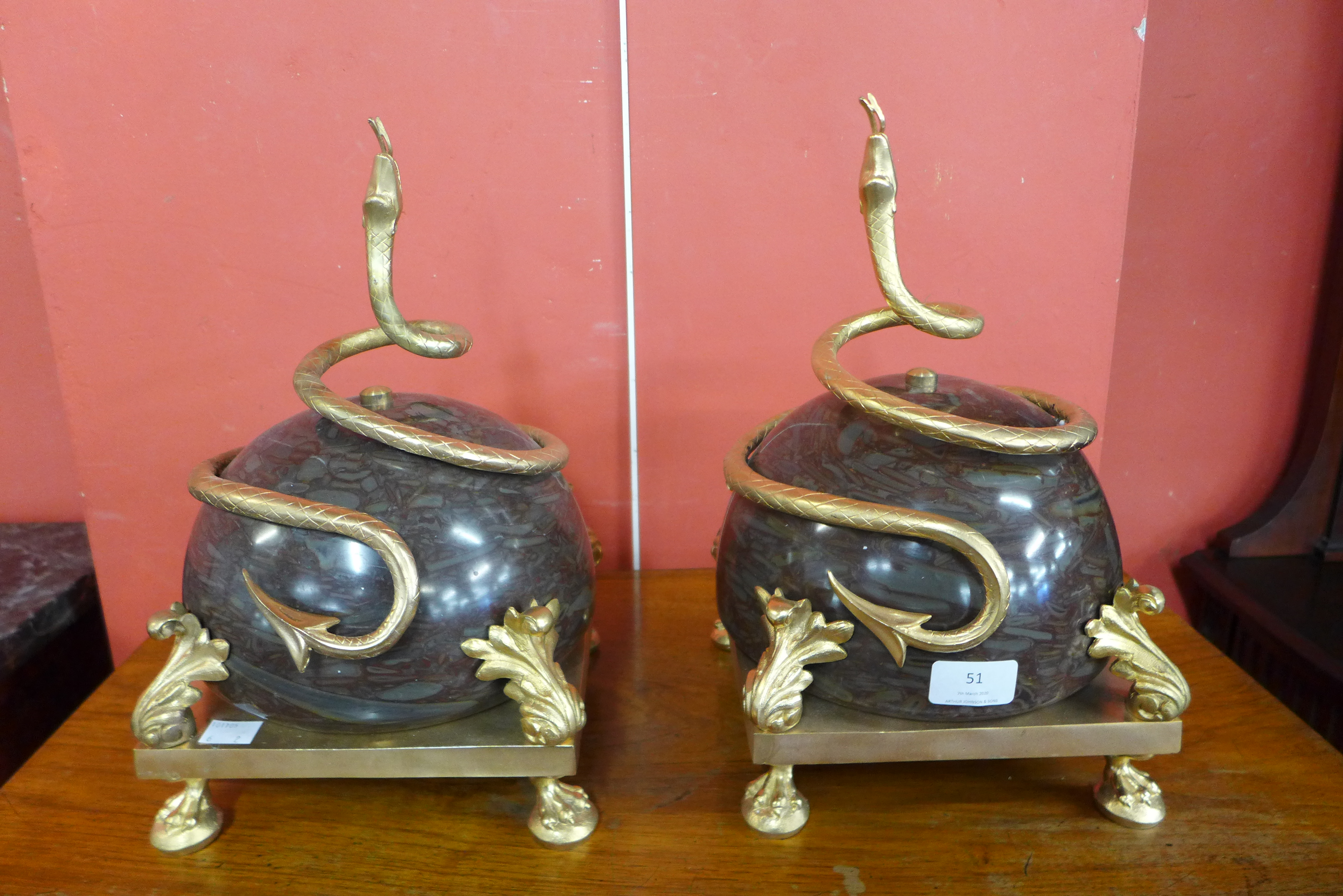 A pair of French style marble and ormolu garnitures