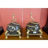 A pair of French style marble and ormolu garnitures