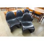 A set of four Verner Panton style black S-shaped chairs