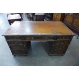 A Victorian oak pedestal library desk