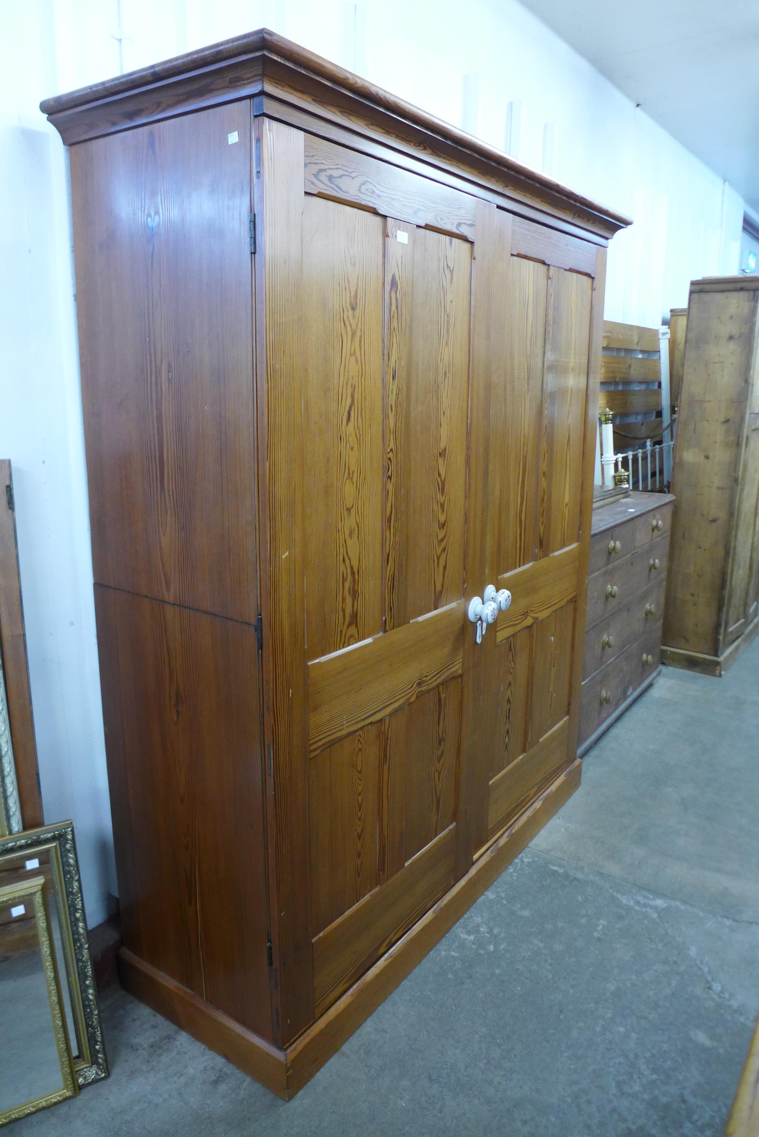 A Victorian style pine wardrobe