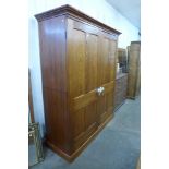 A Victorian style pine wardrobe