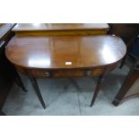 A mahogany demi-lune two drawer hall table