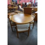 A Danish Vandrup Stolefabrik teak extending dining table and four chairs