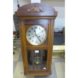 A mahogany wall clock