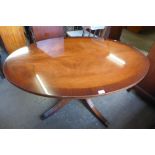 A Bevan & Funnell mahogany oval rise and fall coffee table