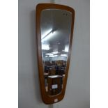 A teak framed mirror