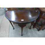 A mahogany demi-lune hall table