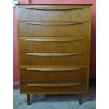 A teak chest of drawers