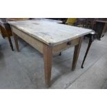 A pine single drawer kitchen table