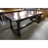 An 18th Century style carved oak refectory table