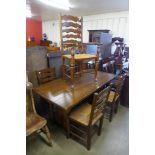 An oak refectory table and five chairs