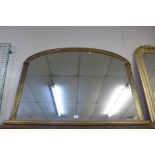 A gilt framed overmantel mirror