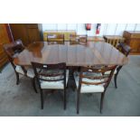 A Regency style inlaid mahogany extending pedestal table and a set of six Regency style mahogany