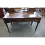 A Victorian mahogany two drawer writing table