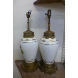 A pair of opaline and gilt glass table lamps