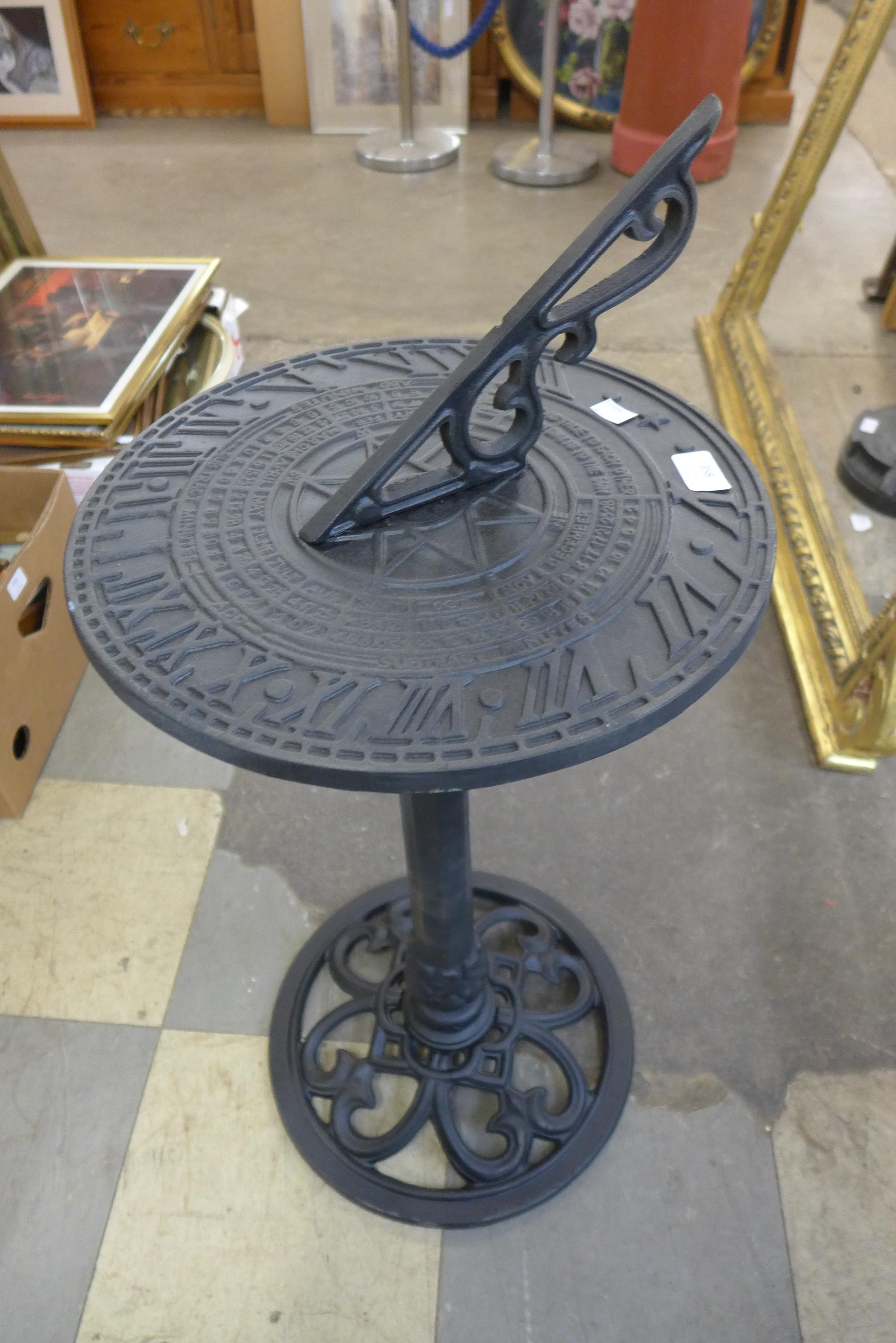 A cast iron and aluminium sun dial