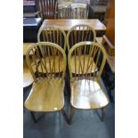 A set of four Victorian elm and beech kitchen chairs